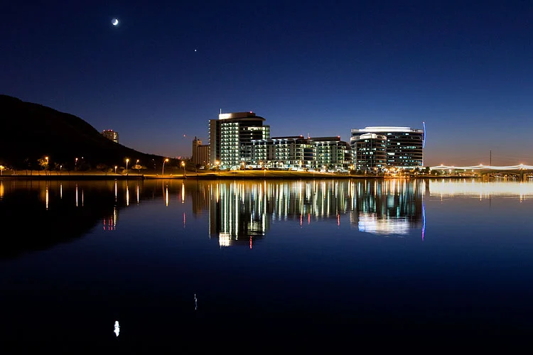 Tempe's illuminated waterfront skyline reflected in Town Lake at night