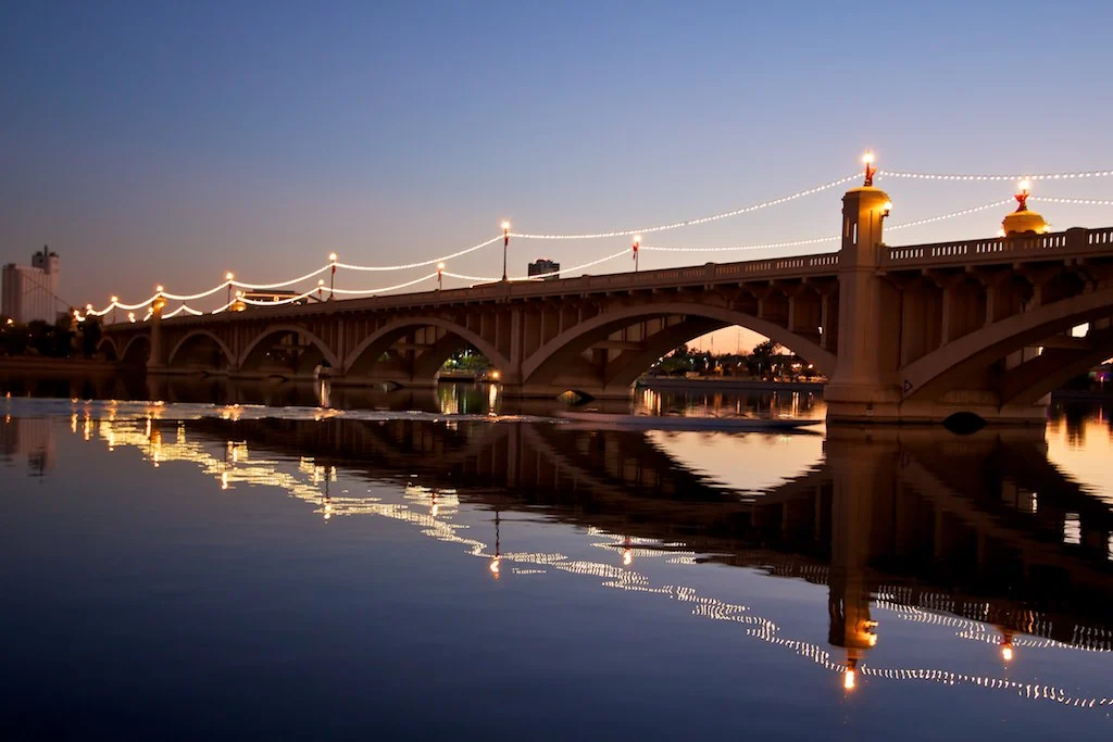 Mill Avenue Bridge reflecting in Tempe Town Lake at dusk